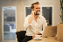 man using smartphone on chair
